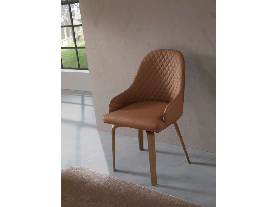 Sedia Atena in pelle con gambe in legno di Ozzio